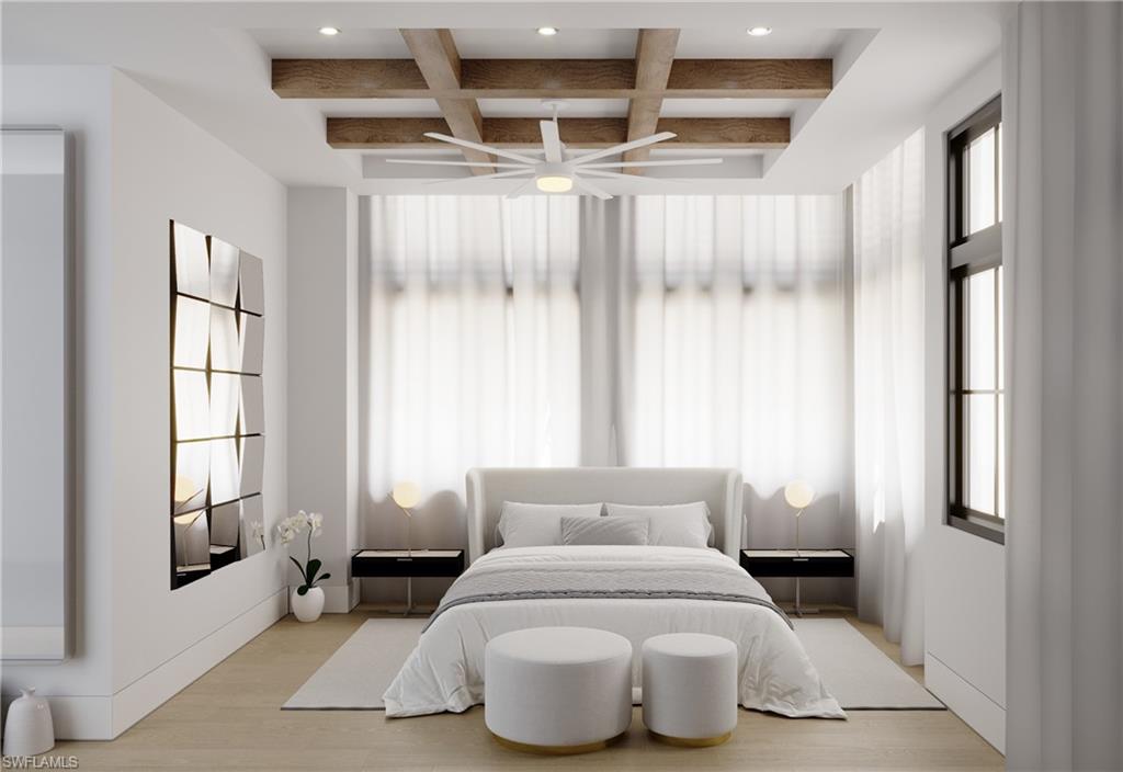 180 9th Street South, Unit 301 Naples, FL 34102 - Photo 4 of 8 a bedroom with a bed and window