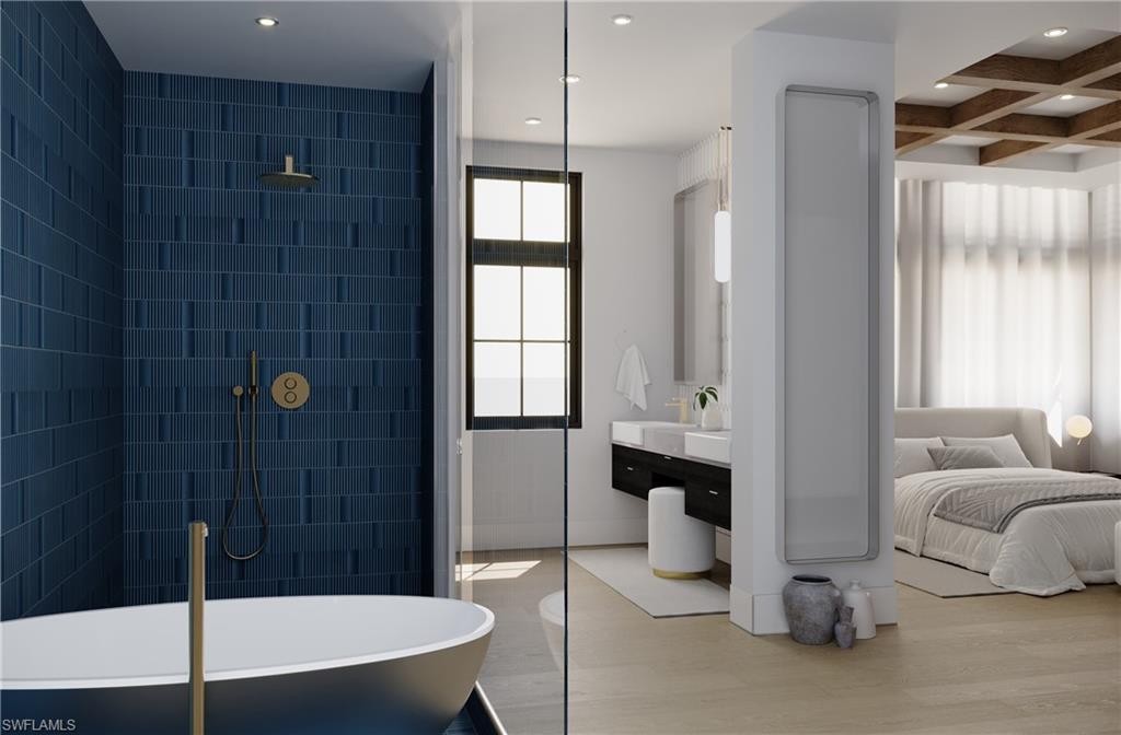 180 9th Street South, Unit 301 Naples, FL 34102 - Photo 6 of 8 a bathroom with a bathtub and a shower