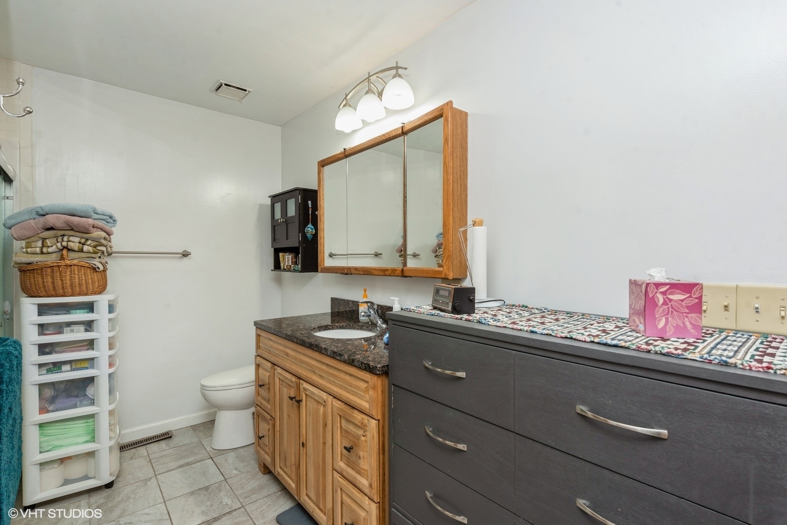 19108 Lincoln Road Harvard, IL 60033 - Photo 20 of 22 a bathroom with a sink a toilet and a mirror