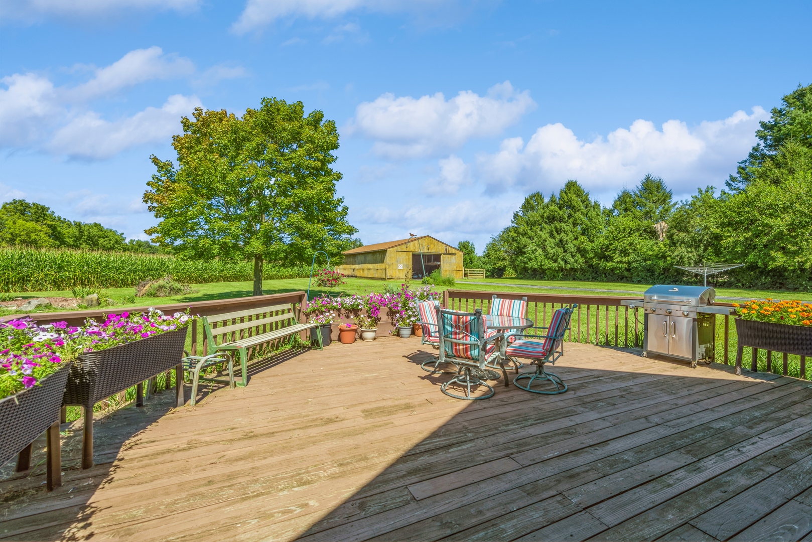 19108 Lincoln Road Harvard, IL 60033 - Photo 3 of 22 a view of a deck with two chairs next to a yard