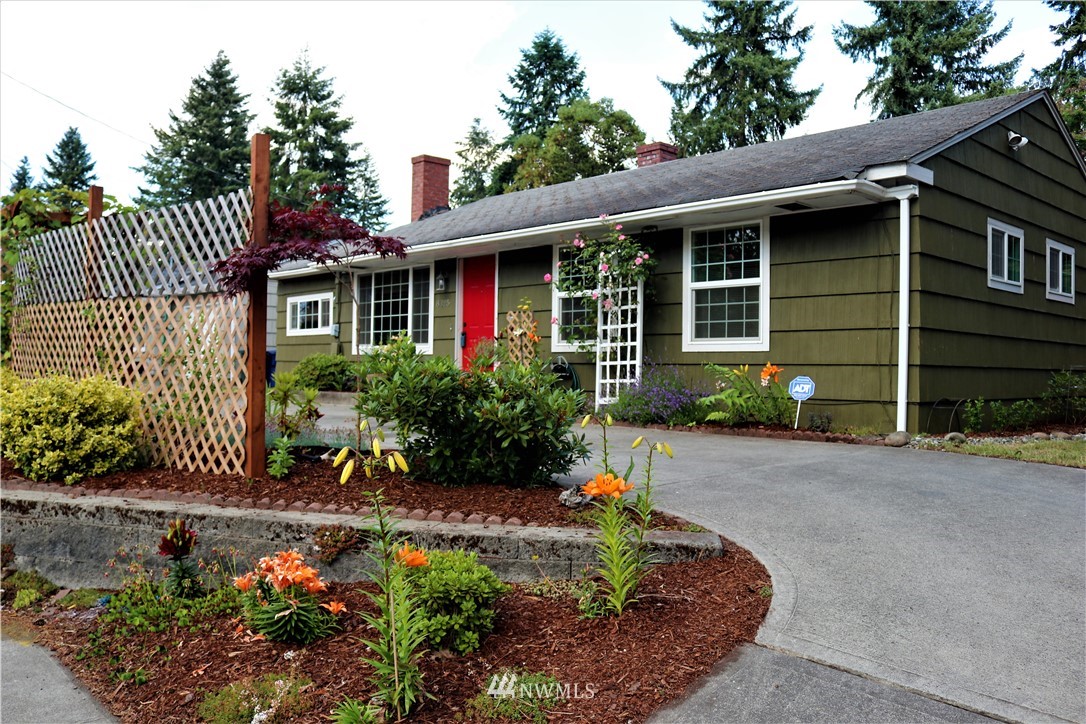 8325 Custer Road Southwest Lakewood, WA 98499 - Photo 1 of 20 a front view of a house with a yard