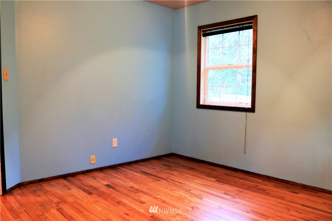 8325 Custer Road Southwest Lakewood, WA 98499 - Photo 11 of 20 a view of empty room with wooden floor and fan