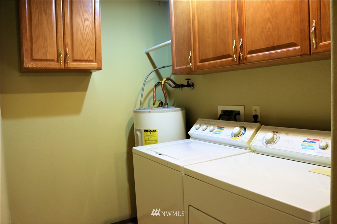 8325 Custer Road Southwest Lakewood, WA 98499 - Photo 15 of 20 a utility room with dryer and washer