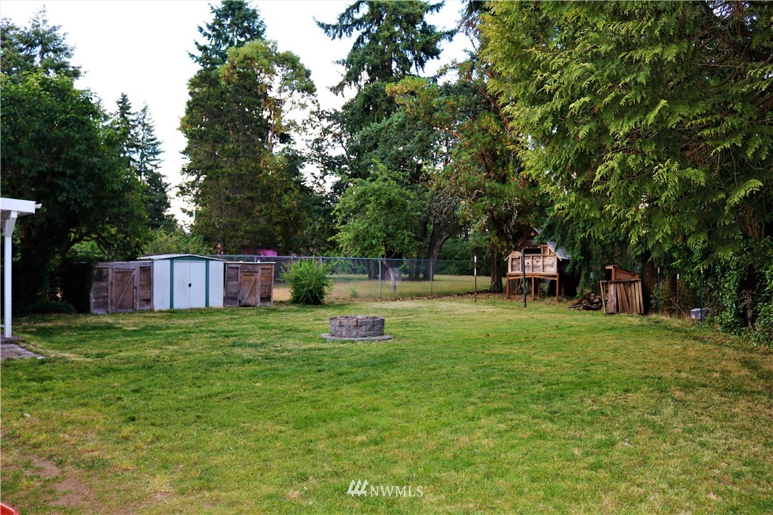 8325 Custer Road Southwest Lakewood, WA 98499 - Photo 18 of 20 a view of a tiny house with backyard
