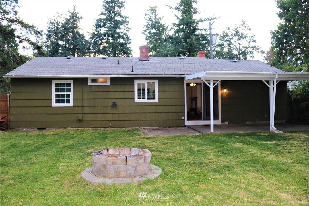 8325 Custer Road Southwest Lakewood, WA 98499 - Photo 19 of 20 a view of a house with a yard