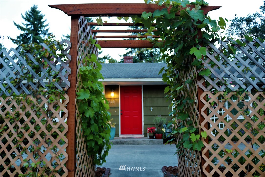 8325 Custer Road Southwest Lakewood, WA 98499 - Photo 3 of 20 a view of a house with a yard and tree