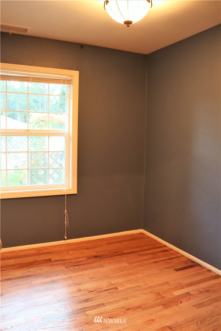 8325 Custer Road Southwest Lakewood, WA 98499 - Photo 8 of 20 a view of empty room with wooden floor