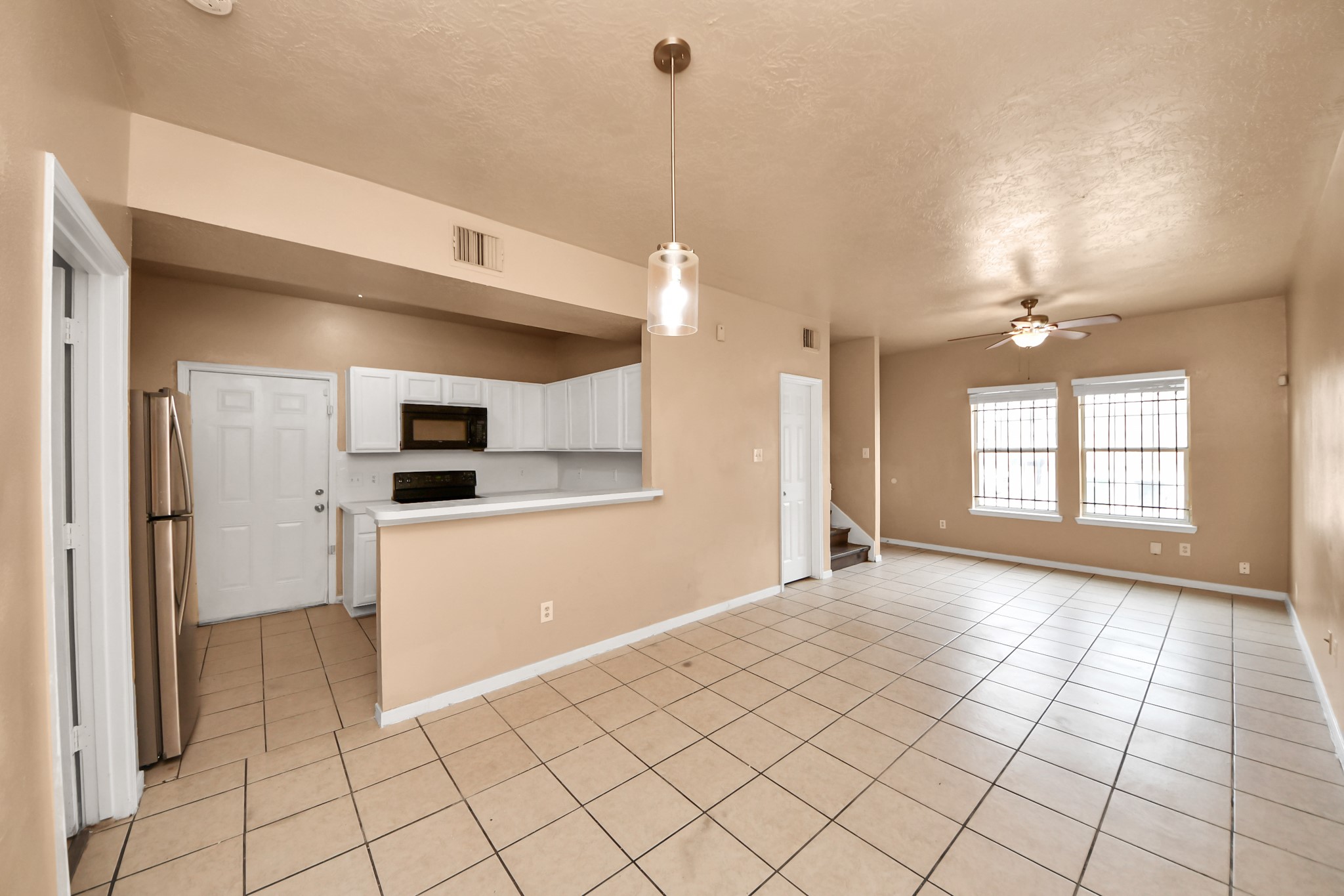 8130 Jutland Road Houston, TX 77033 - Photo 13 of 47 a view of a kitchen with a sink and a refrigerator