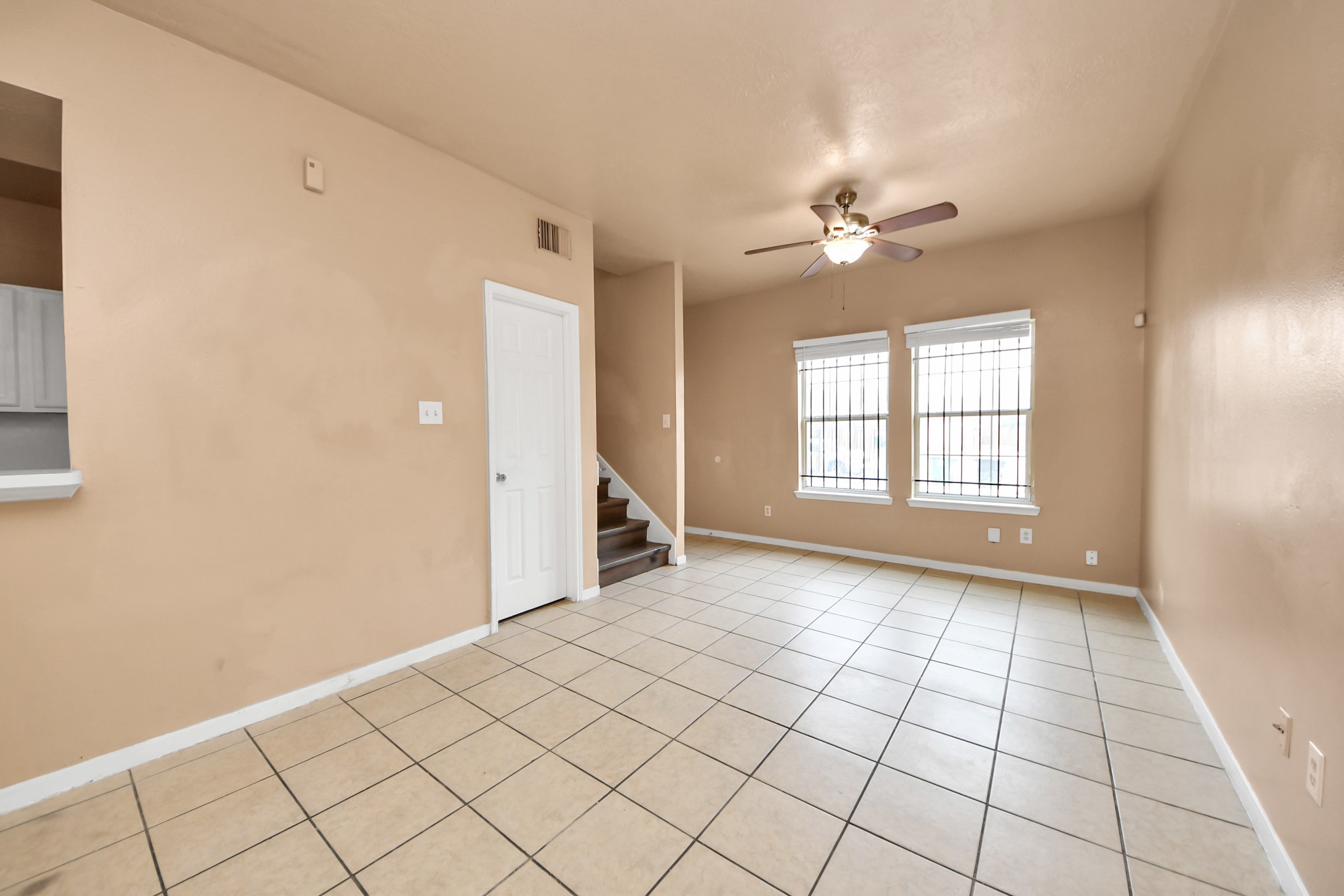 8130 Jutland Road Houston, TX 77033 - Photo 16 of 47 an empty room with windows and fan