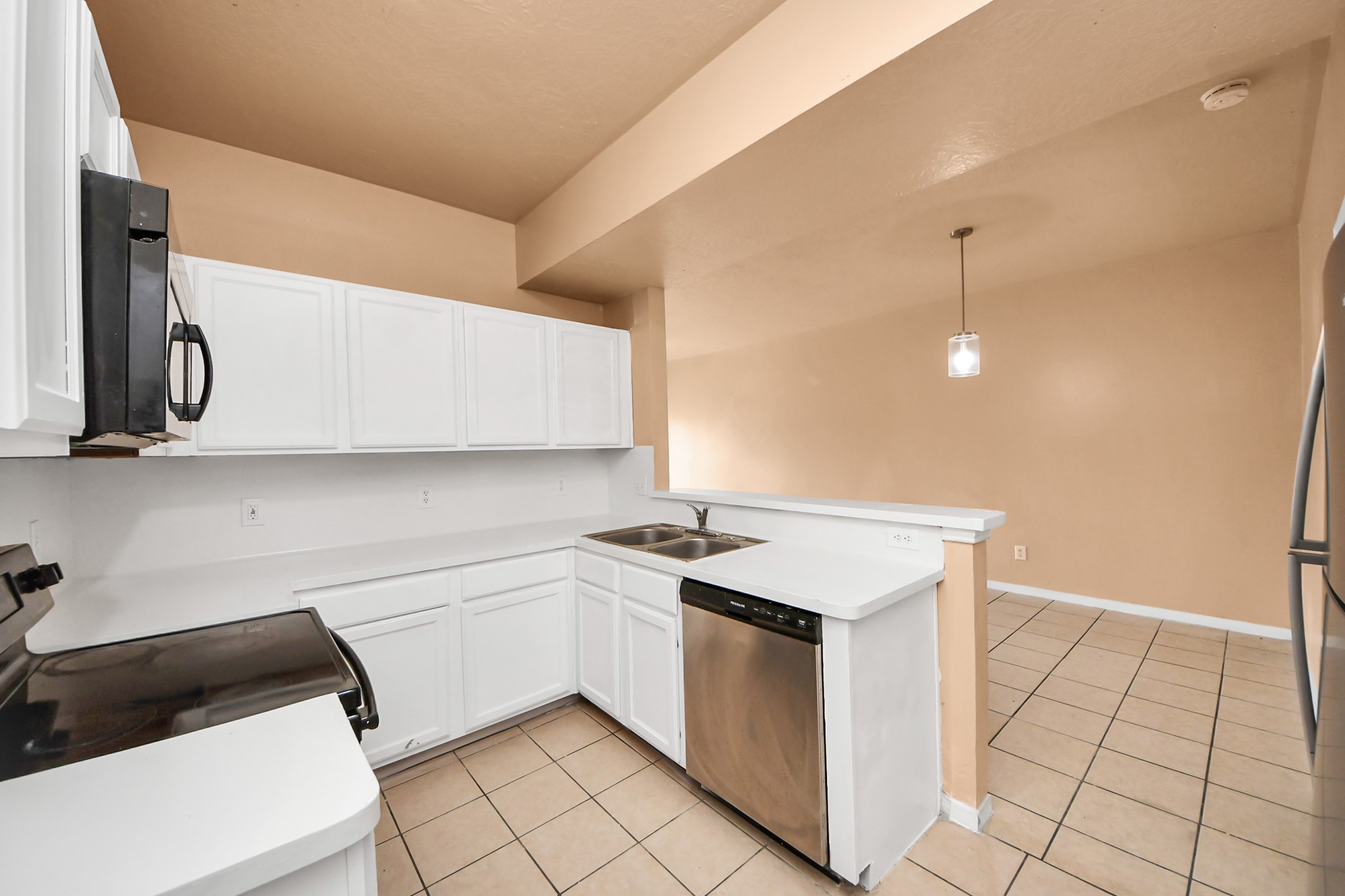 8130 Jutland Road Houston, TX 77033 - Photo 20 of 47 a utility room with cabinets washer and dryer