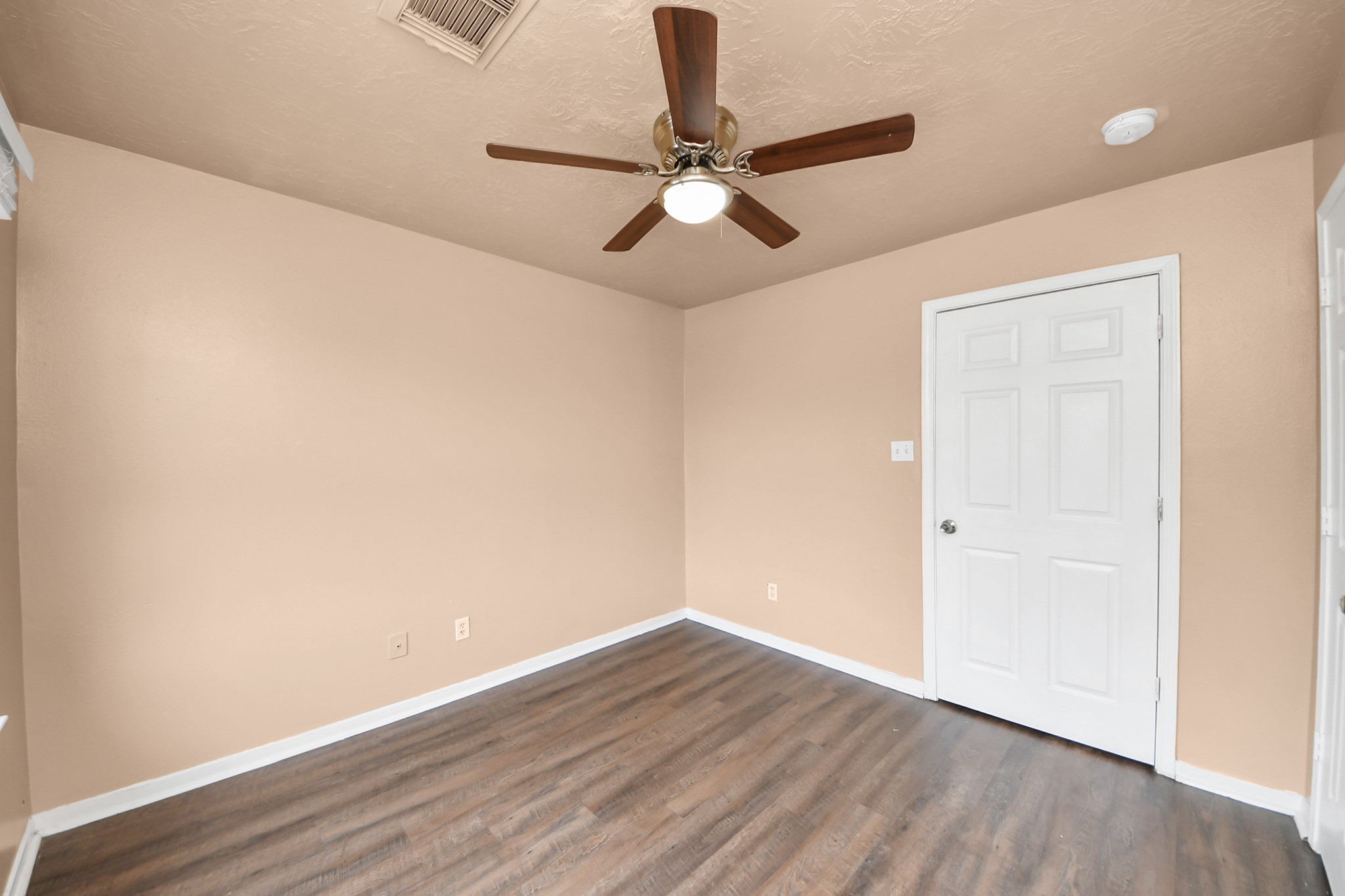 8130 Jutland Road Houston, TX 77033 - Photo 31 of 47 a view of an empty room with wooden floor