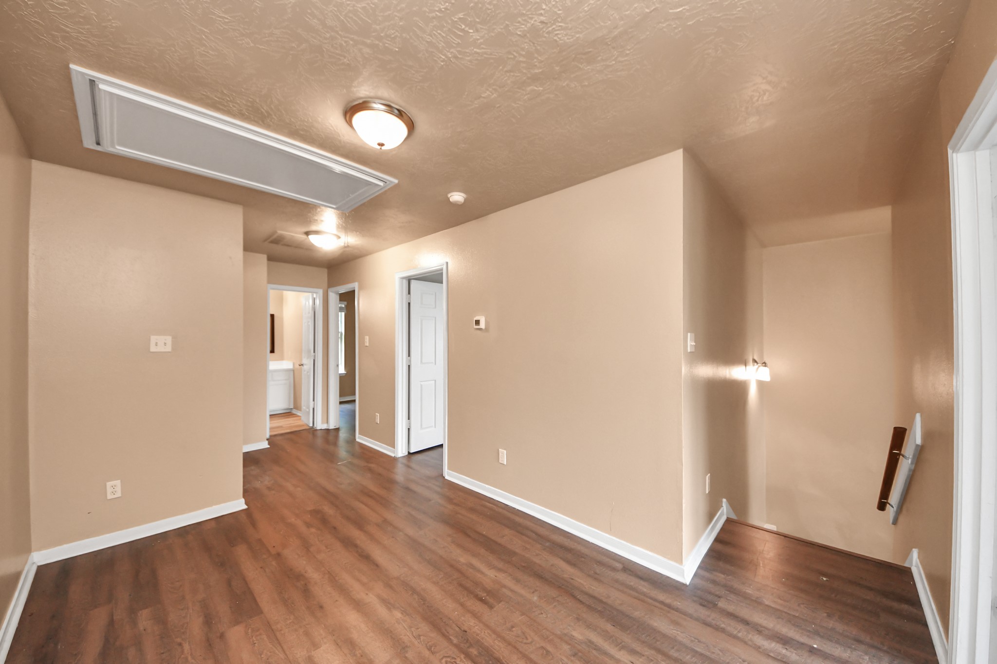 8130 Jutland Road Houston, TX 77033 - Photo 34 of 47 a view of a hallway with wooden floor