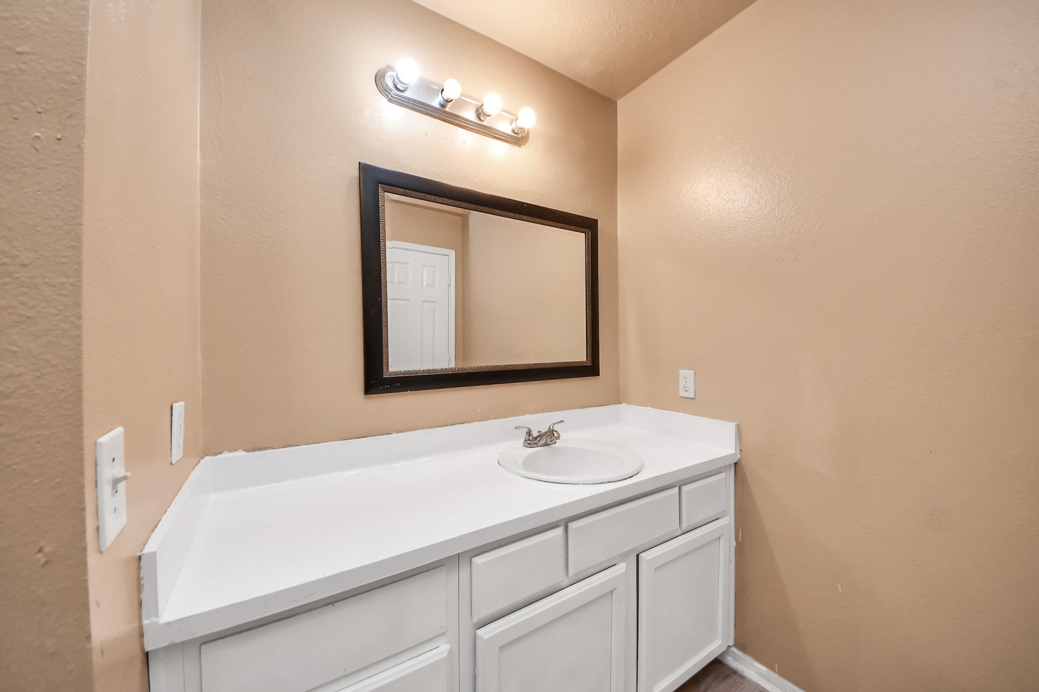 8130 Jutland Road Houston, TX 77033 - Photo 42 of 47 a bathroom with a sink and a mirror