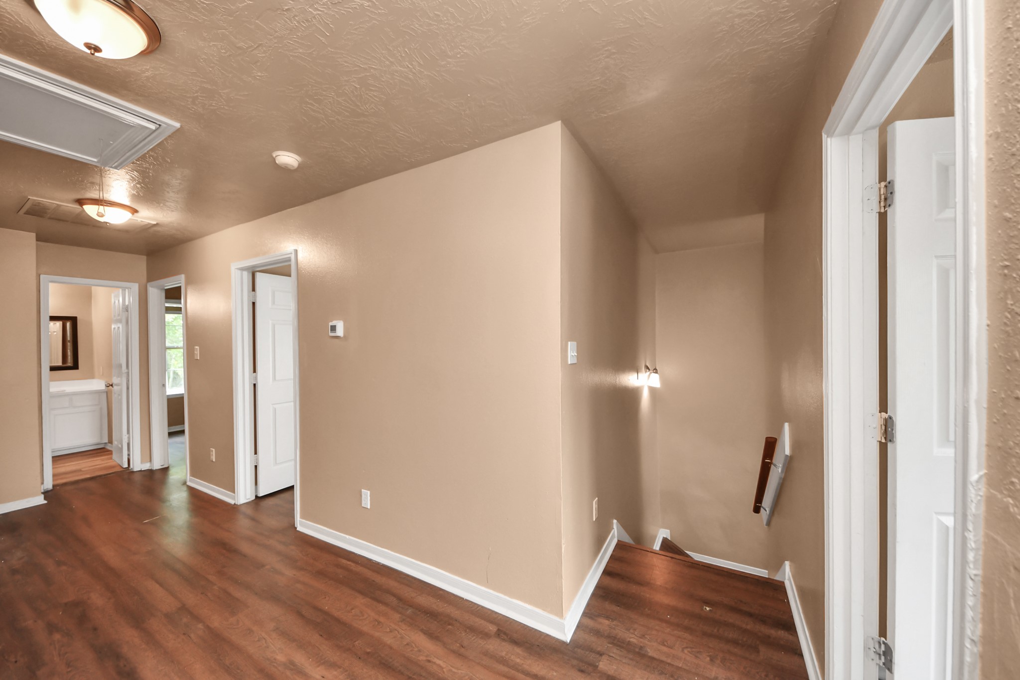 8130 Jutland Road Houston, TX 77033 - Photo 43 of 47 a view of a hallway with wooden floor