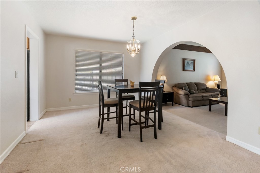 17656 Mockingbird Hill Circle Riverside, CA 92504 - Photo 9 of 49 a view of a livingroom with furniture and window