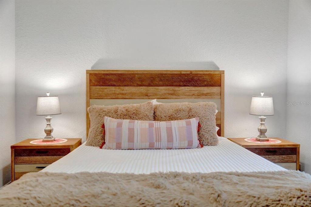 2925 24th Street North St. Petersburg, FL 33713 - Photo 22 of 33 a bedroom with a bed and a lamp