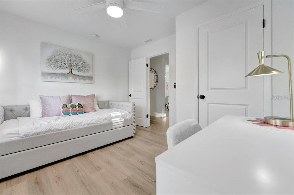 2925 24th Street North St. Petersburg, FL 33713 - Photo 30 of 33 a spacious bedroom with a bed and a couch