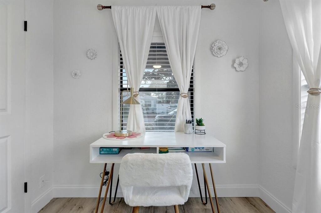 2925 24th Street North St. Petersburg, FL 33713 - Photo 32 of 33 a view of a workspace with furniture and wooden floor