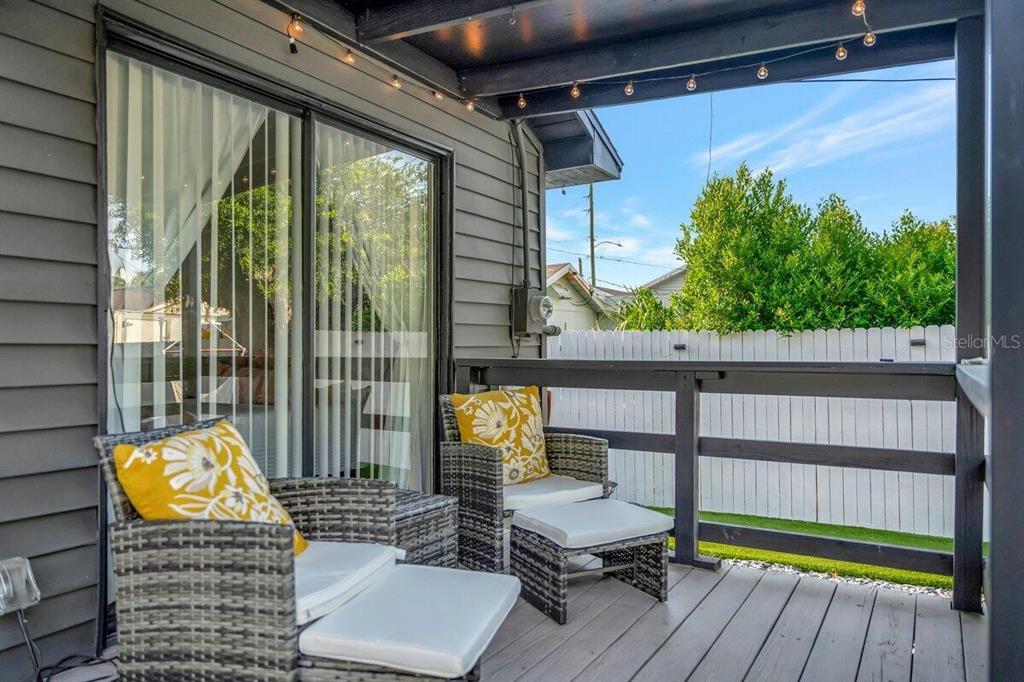 2925 24th Street North St. Petersburg, FL 33713 - Photo 6 of 33 a view of balcony with wooden floor and outdoor seating