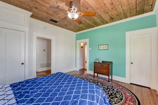 a bedroom with a bed and a chair