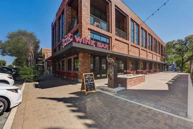 a view of a building with sitting area