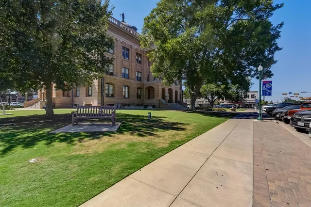 a house view with a sitting space and garden