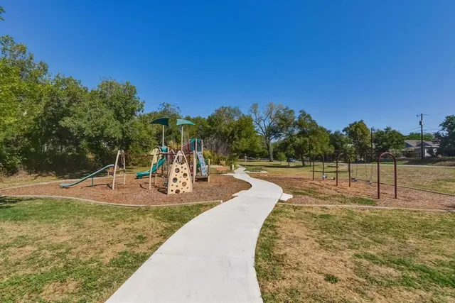 a view of a playground with basketball court