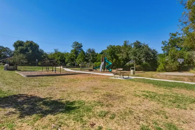 a view of a swimming pool with an outdoor space and seating area