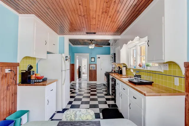 a kitchen with sink and cabinets