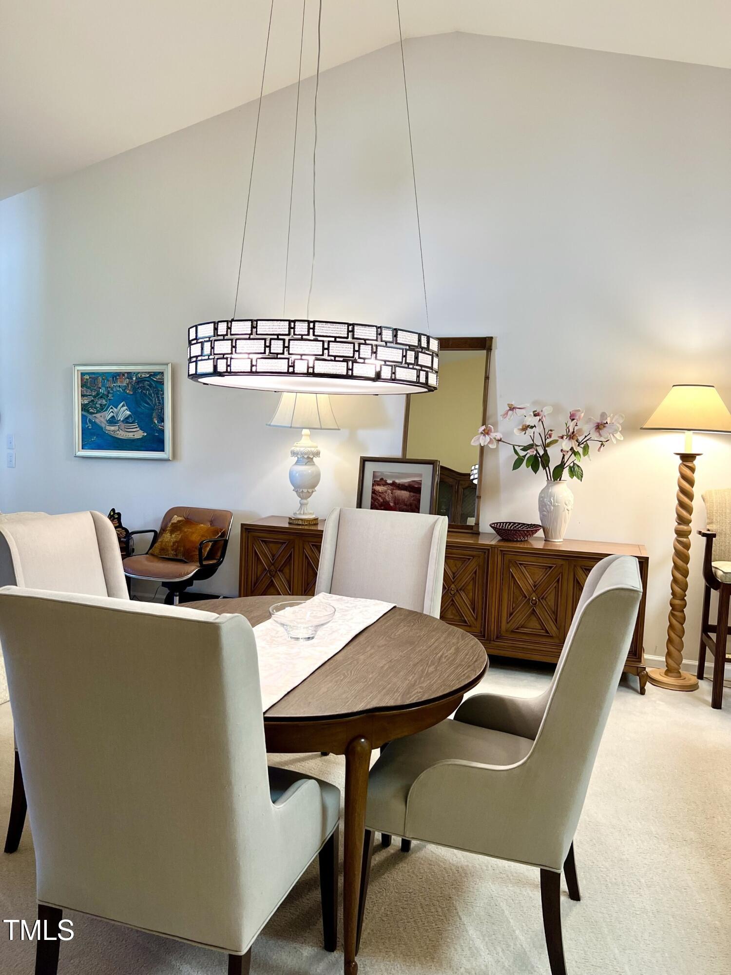 10432 Dapping Drive Raleigh, NC 27614 - Photo 3 of 11 a view of a dining room with furniture