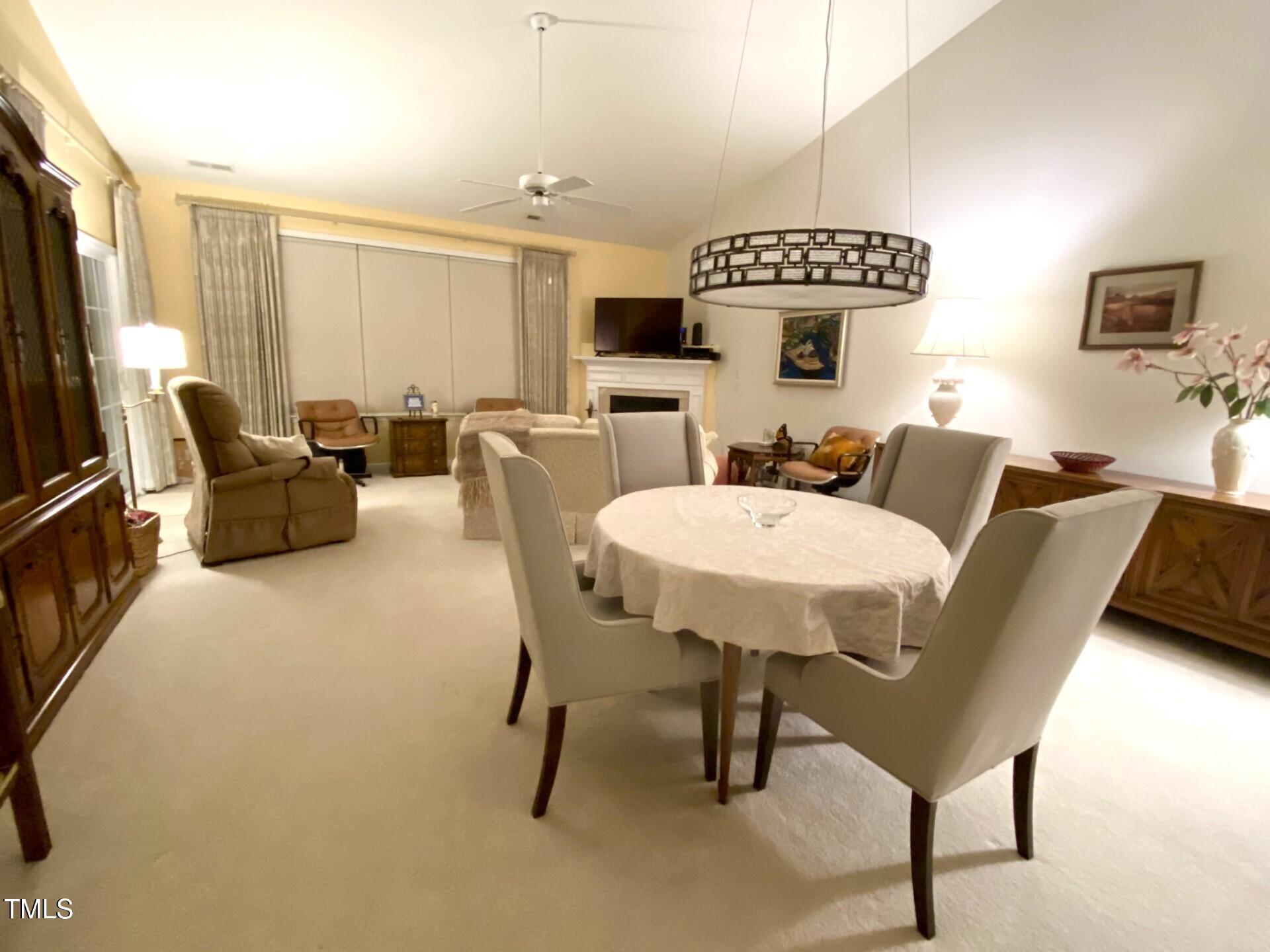 10432 Dapping Drive Raleigh, NC 27614 - Photo 10 of 11 a living room with furniture and a flat screen tv