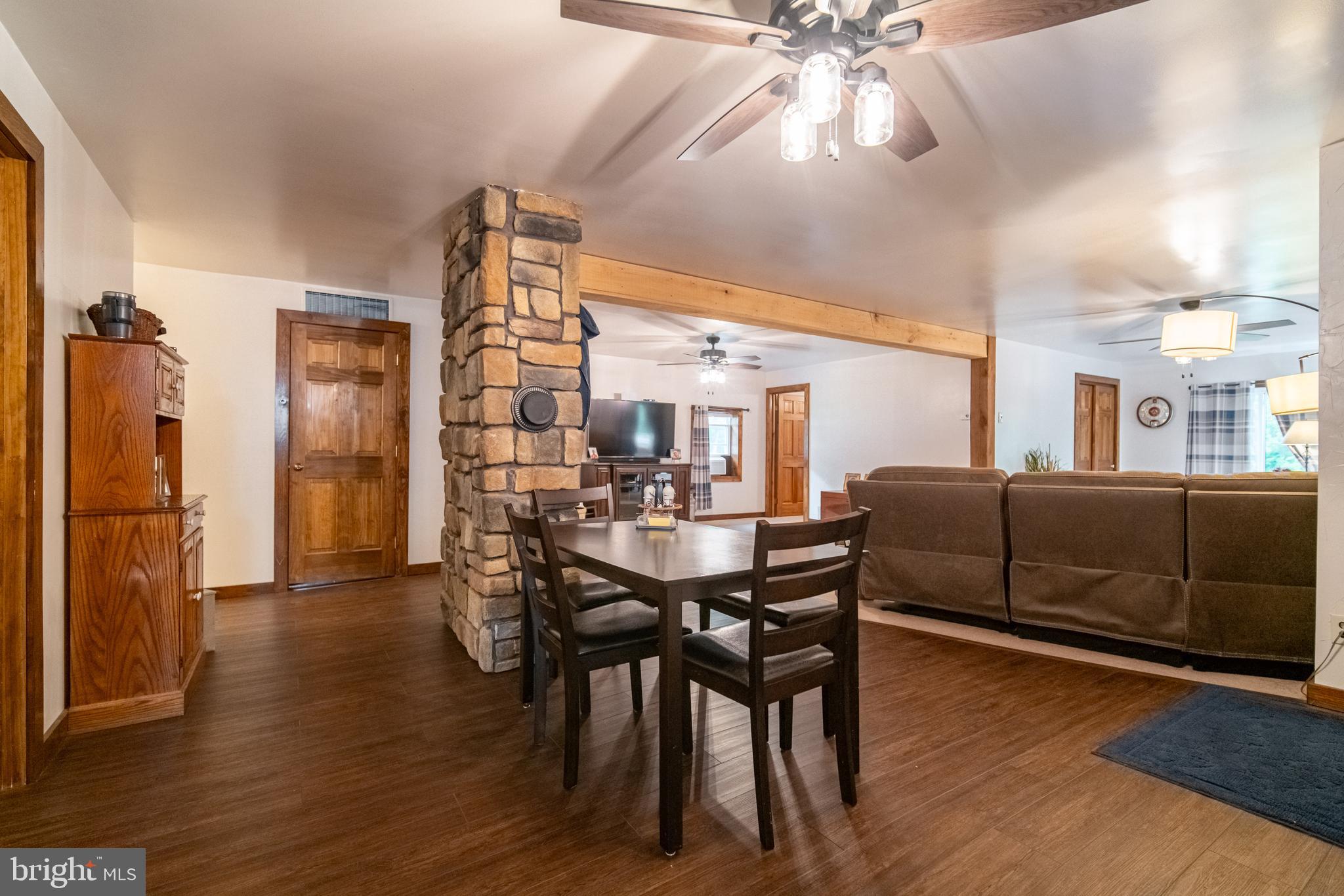 13127 Manor Furnace Road Brogue, PA 17309 - Photo 36 of 78 a view of a dining room with furniture and wooden floor