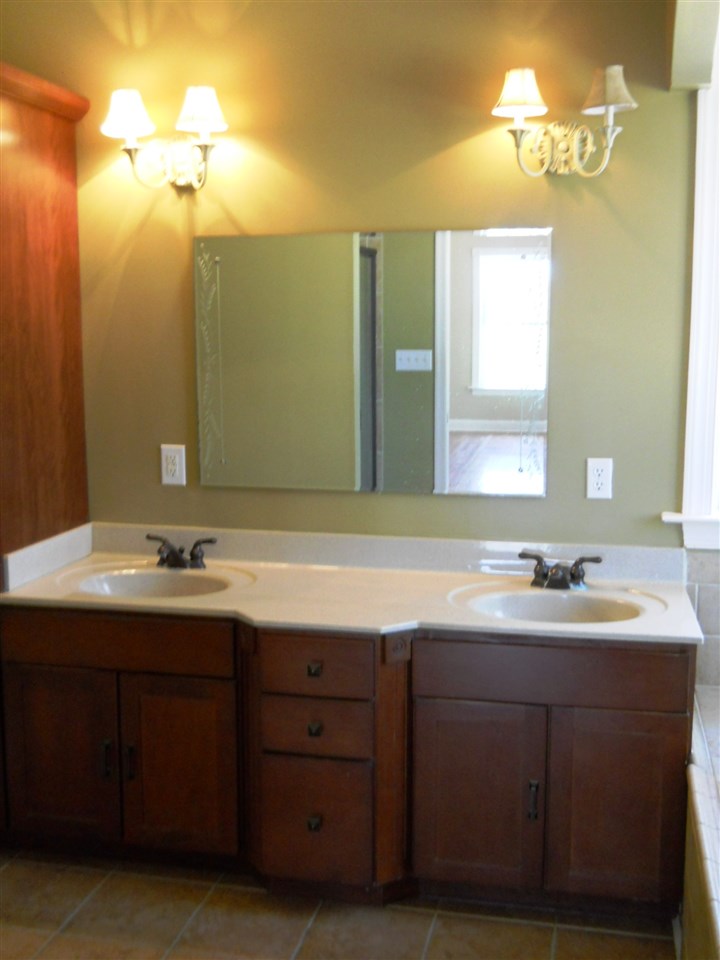 2938 Middlebrook Road Staunton, VA 24401 - Photo 11 of 38 a bathroom with a double vanity sink and a mirror