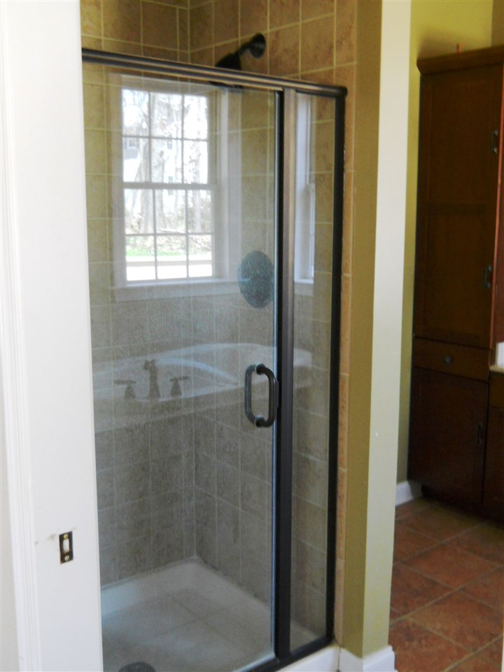 2938 Middlebrook Road Staunton, VA 24401 - Photo 12 of 38 a bathroom with a glass shower door