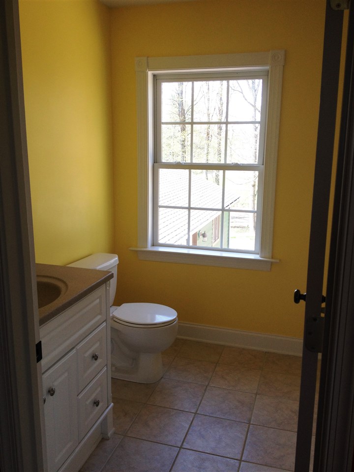 2938 Middlebrook Road Staunton, VA 24401 - Photo 35 of 38 a bathroom with a toilet sink and window