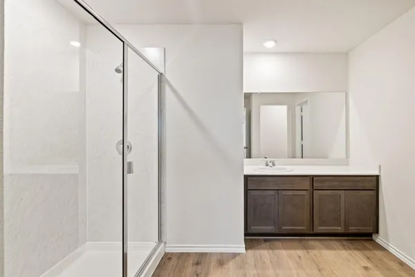 a bathroom with a double vanity sink mirror and
