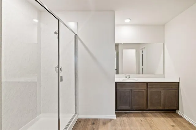 a bathroom with a double vanity sink mirror and