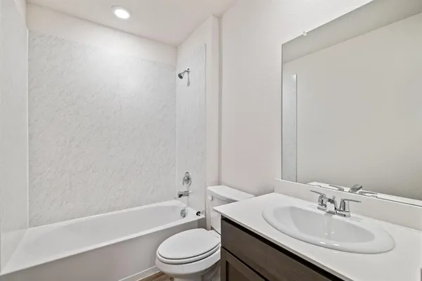a bathroom with a sink toilet and a bathtub