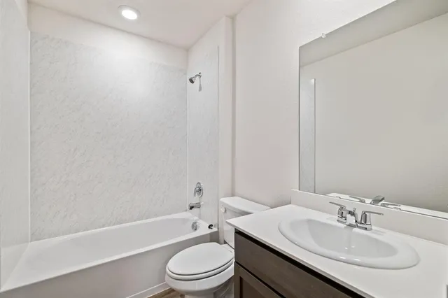 a bathroom with a sink toilet and a bathtub
