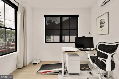 a workspace with furniture and window