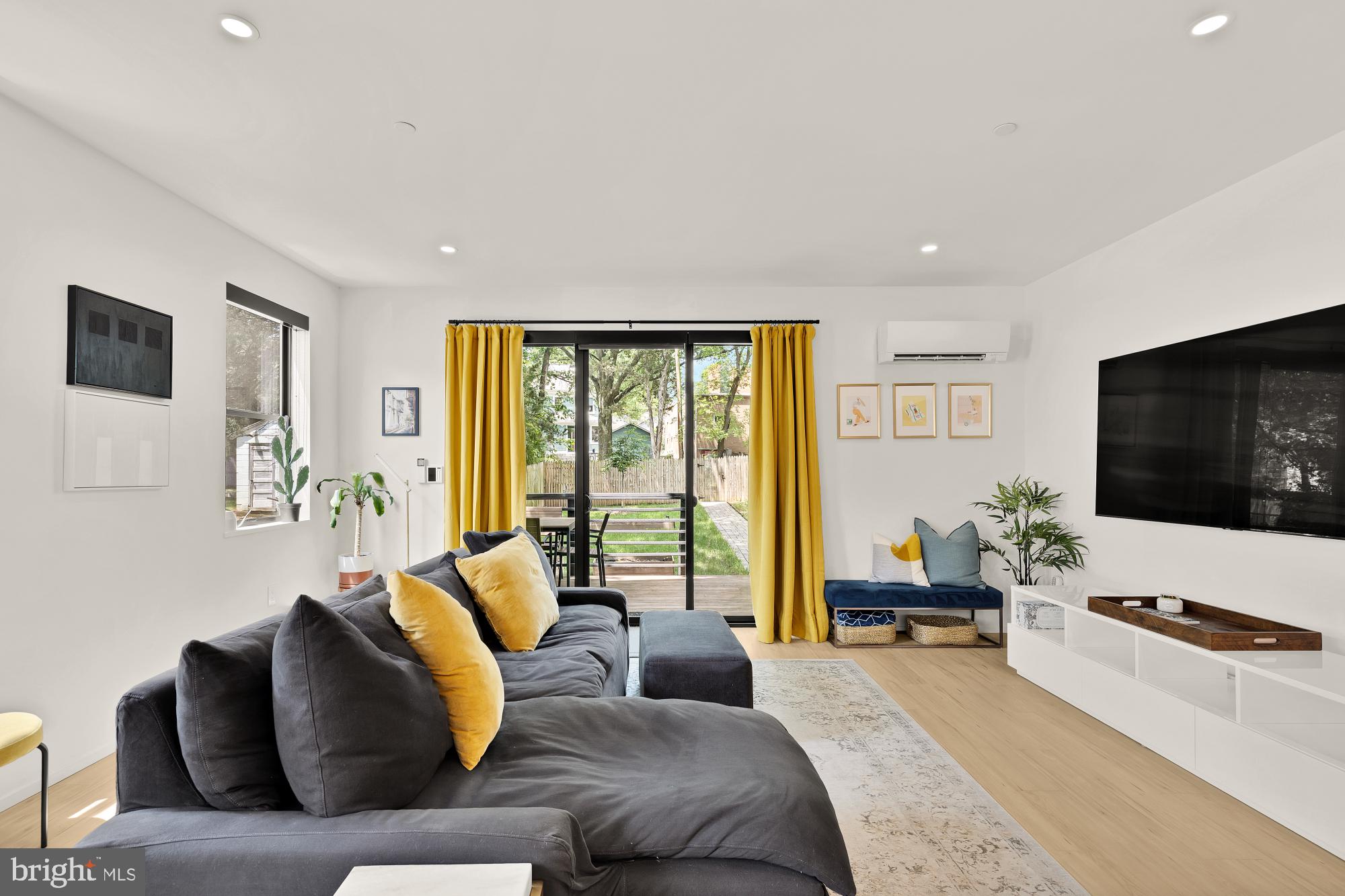 4020 35th Street, Unit B Mount Rainier, MD 20712 - Photo 13 of 42 a living room with furniture and a flat screen tv