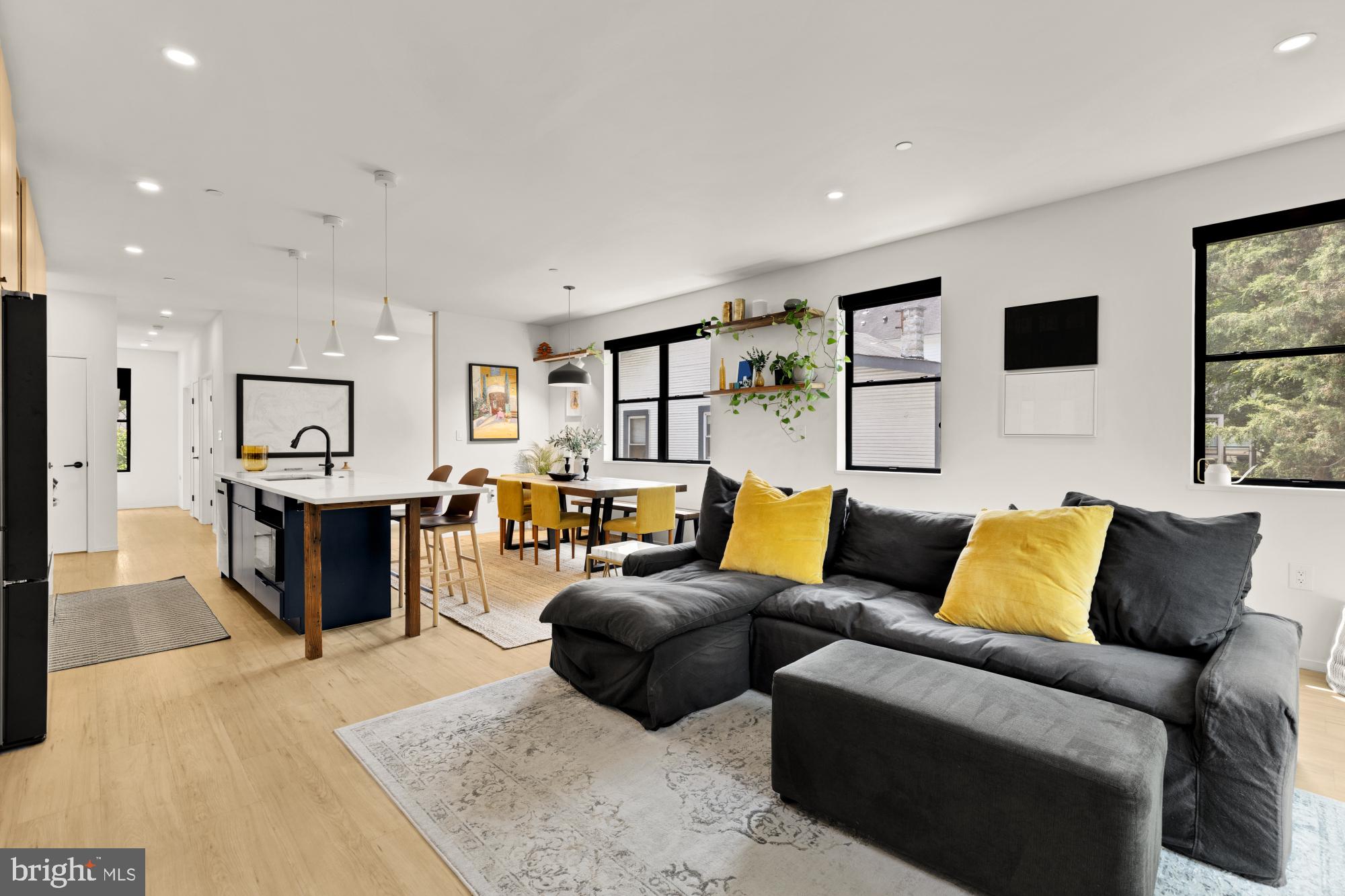 4020 35th Street, Unit B Mount Rainier, MD 20712 - Photo 17 of 42 a living room with furniture and view of kitchen