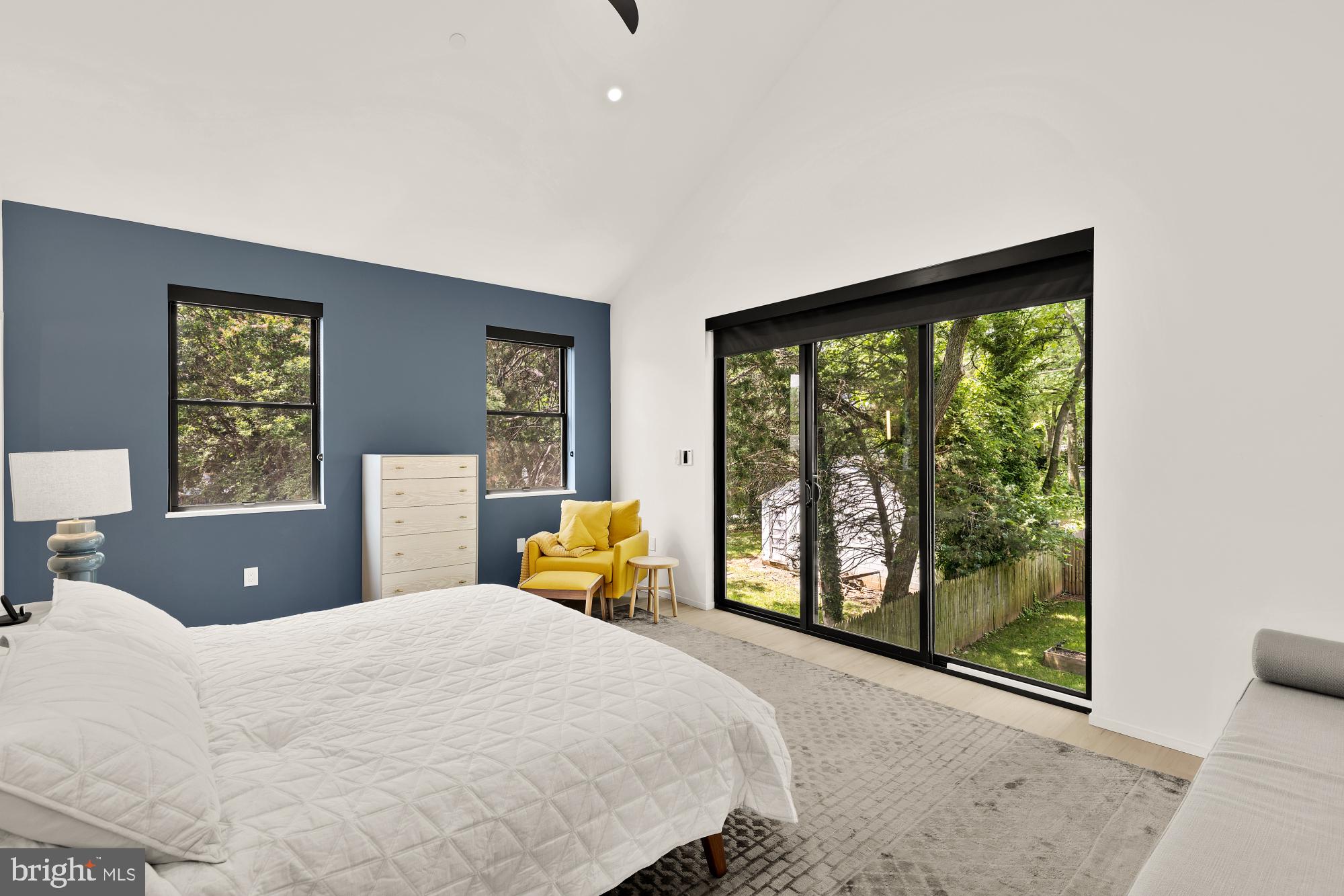 4020 35th Street, Unit B Mount Rainier, MD 20712 - Photo 18 of 42 a bedroom with a bed and large windows