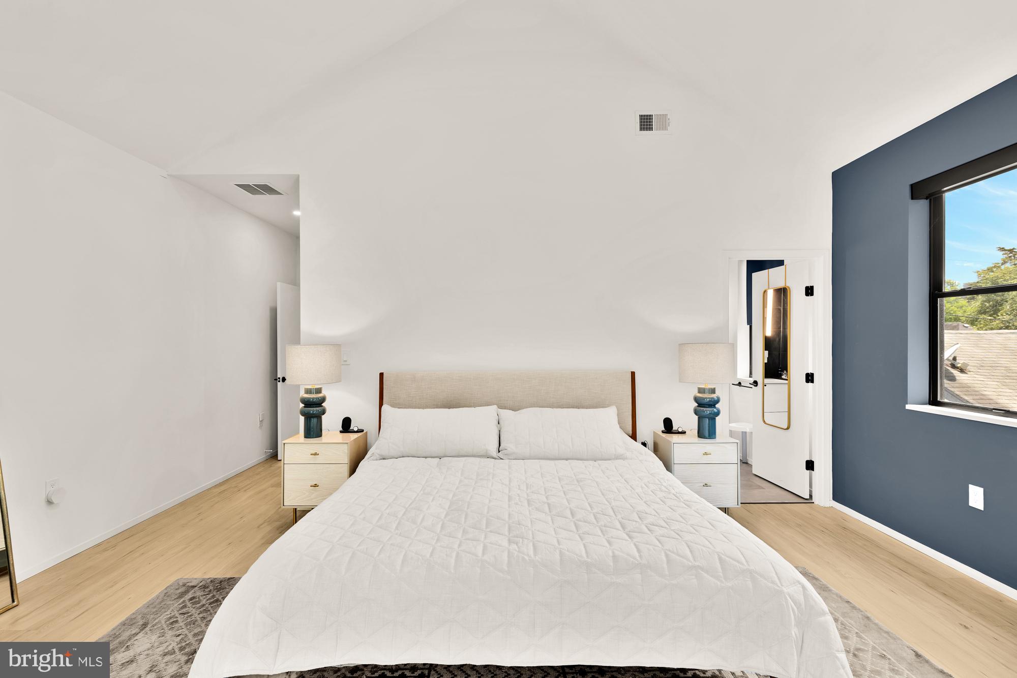 4020 35th Street, Unit B Mount Rainier, MD 20712 - Photo 19 of 42 a bedroom with a large bed and a window