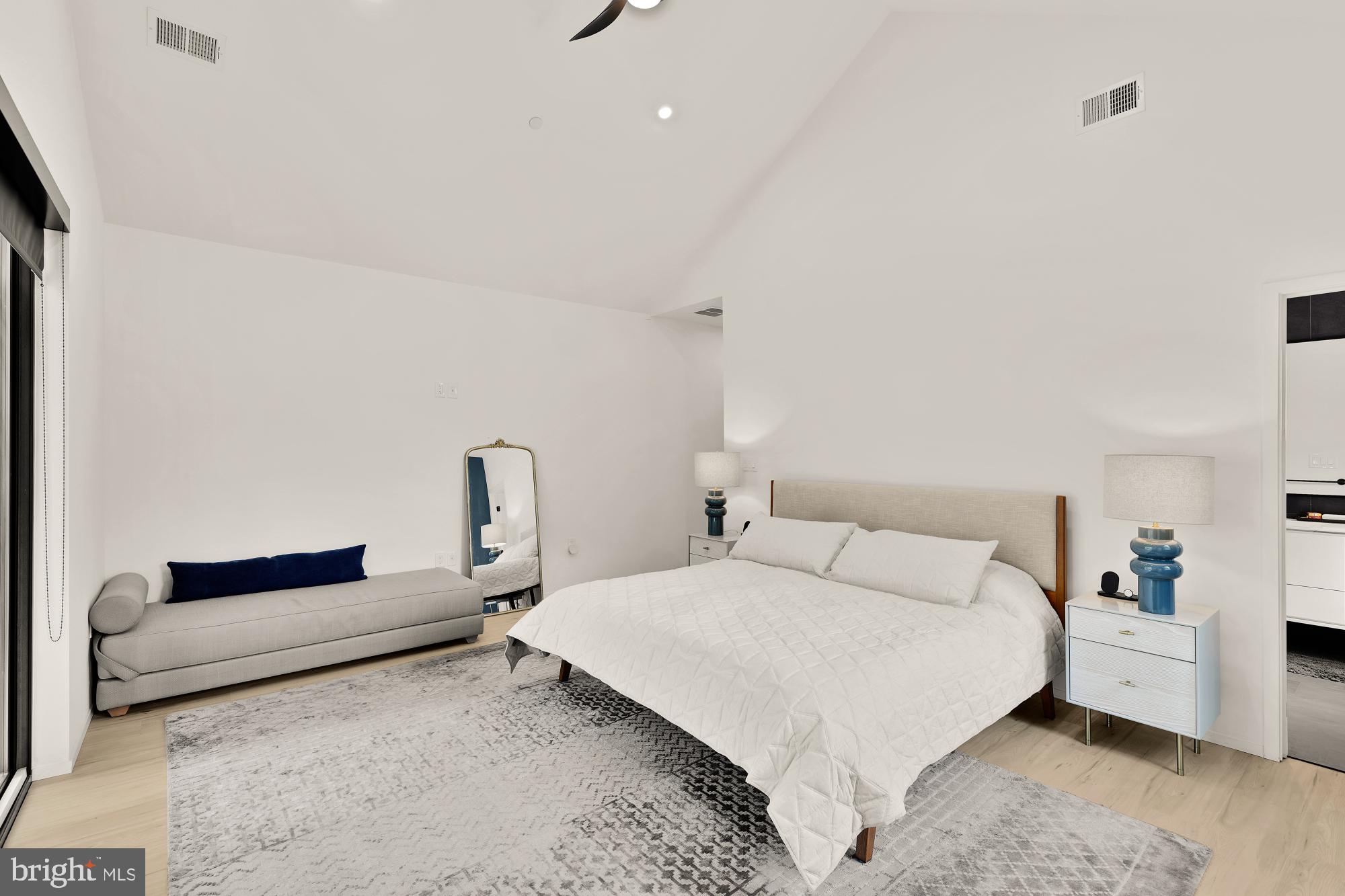 4020 35th Street, Unit B Mount Rainier, MD 20712 - Photo 20 of 42 a bedroom with a bed and a lamp on desk