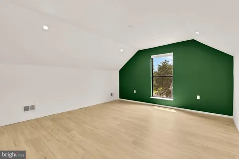 a view of a livingroom with an empty space and a window