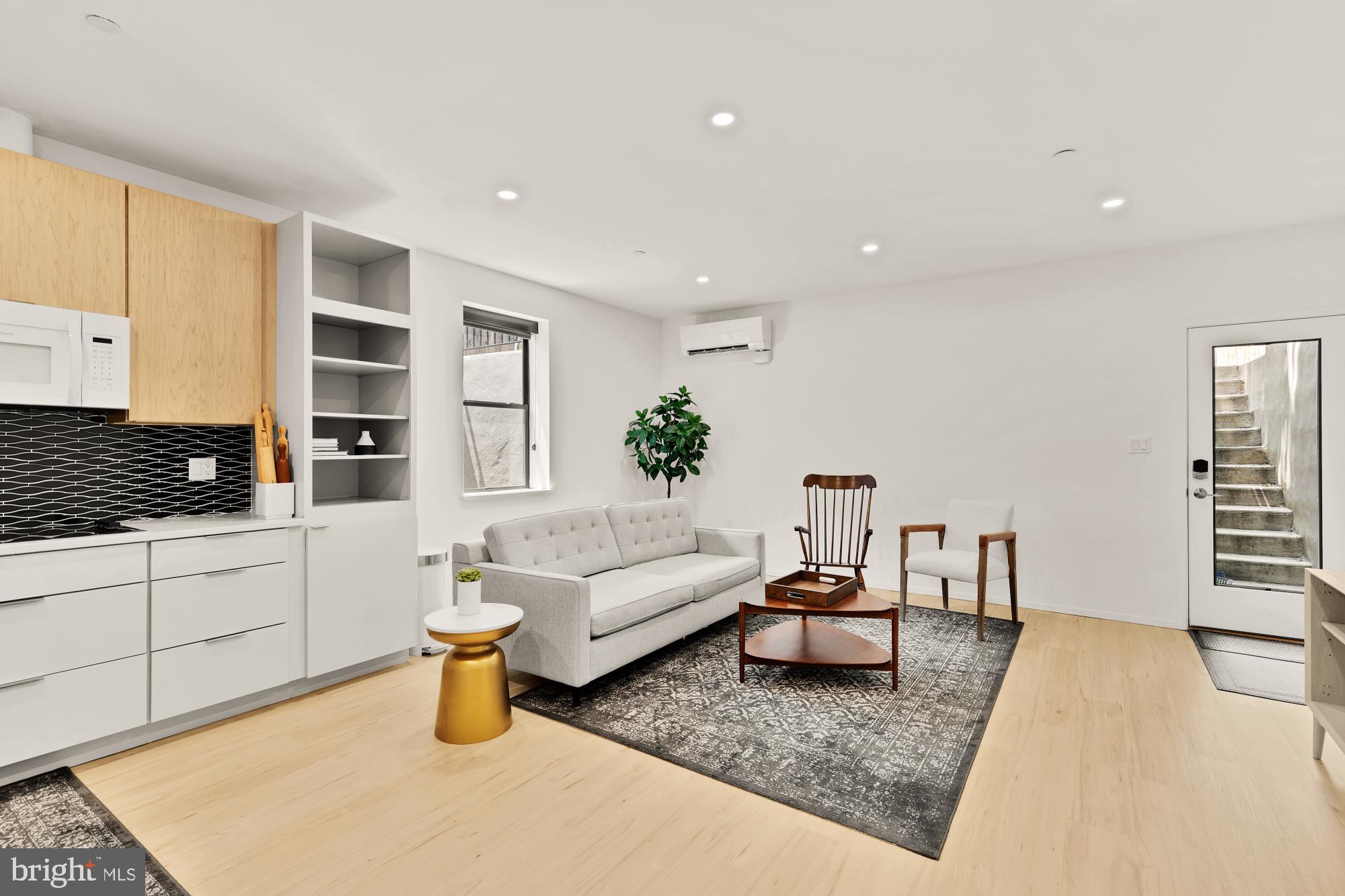 4020 35th Street, Unit B Mount Rainier, MD 20712 - Photo 31 of 42 a living room with furniture and wooden floor