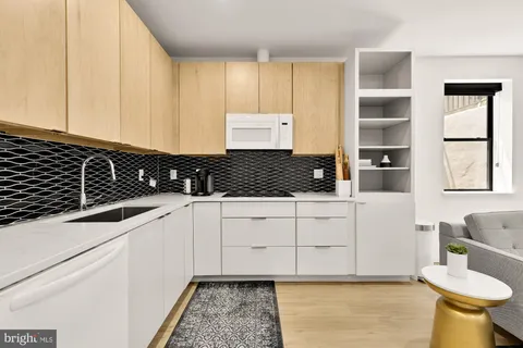 a kitchen with a sink and cabinets