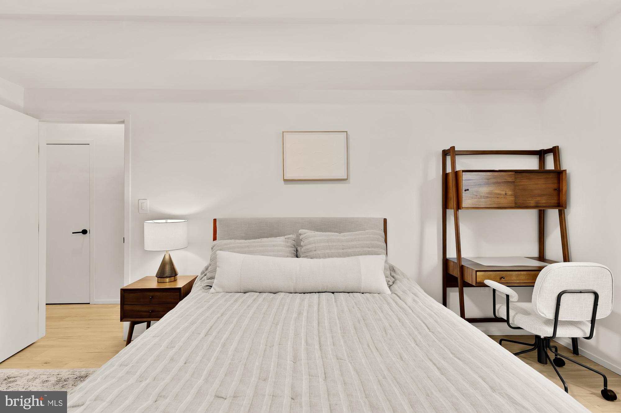 4020 35th Street, Unit B Mount Rainier, MD 20712 - Photo 34 of 42 a bedroom with a bed and a chair