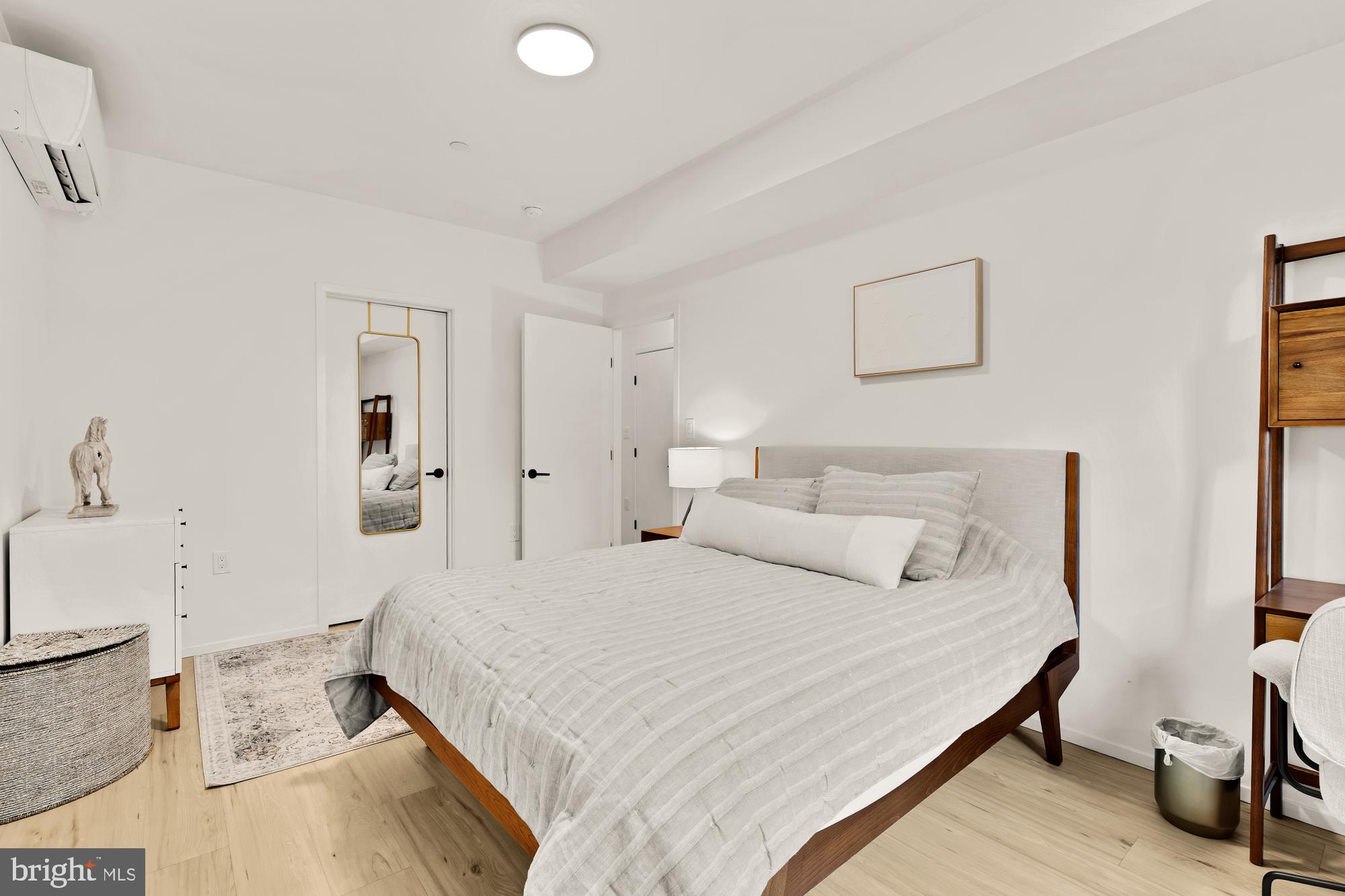 4020 35th Street, Unit B Mount Rainier, MD 20712 - Photo 35 of 42 a bedroom with a bed and a couch